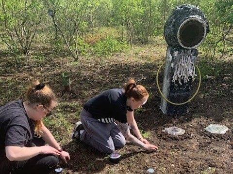 Two women investigating the Ravenscraig site.